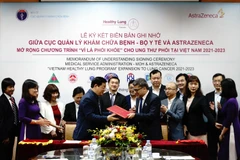 Lễ ký kết biên bản ghi nhớ hợp tác. (Ảnh: Bích Thủy/TTXVN)