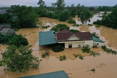 Lũ lớn trên sông Hiếu gây ngập diện rộng tại khu vực xã Thanh An, huyện Cam Lộ và phường Đông Giang, thành phố Đông Hà, tỉnh Quảng Trị. (Ảnh: Hồ Cầu/TTXVN)