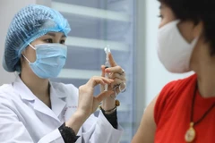 Tiêm vaccine ngừa COVID-19. (Nguồn: TTXVN)