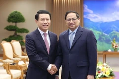 Thủ tướng Phạm Minh Chính tiếp Phó Thủ tướng, Bộ trưởng Ngoại giao Lào Saleumxay Kommasith. (Ảnh: Dương Giang/TTXVN)