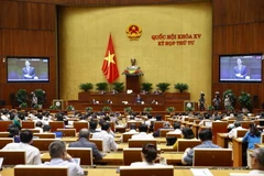 Bộ trưởng Bộ Thông tin và Truyền thông Nguyễn Mạnh Hùng trả lời chất vấn. (Ảnh: Doãn Tấn/TTXVN)