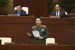 Bộ trưởng Bộ Quốc phòng Phan Văn Giang phát biểu giải trình, làm rõ một số vấn đề đại biểu Quốc hội nêu. (Ảnh: Doãn Tấn/TTXVN)