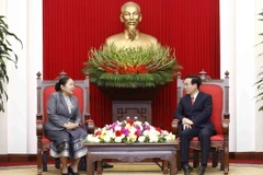 Ông Võ Văn Thưởng tiếp bà Sisay Leudetmounsone. (Ảnh: An Đăng/TTXVN)