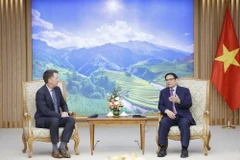 Thủ tướng Phạm Minh Chính tiếp ông Andy Campion, Giám đốc điều hành Tập đoàn Nike. (Ảnh: Dương Giang/TTXVN)