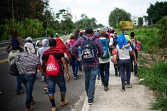 Người di cư Trung Mỹ tại Tapachula, bang Chiapas, Mexico, ngày 12/4, trong hành trình tới Mỹ. (Ảnh: AFP/TTXVN)