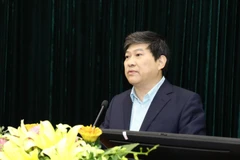 Phó giáo sư, tiến sỹ Nguyễn Duy Bắc, Phó Giám Học viện Chính trị quốc gia Hồ Chí Minh Báo cáo đề dẫn hội thảo. (Ảnh: Văn Điệp/TTXVN) 