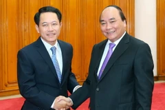 Thủ tướng Nguyễn Xuân Phúc tiếp Bộ trưởng Ngoại giao Lào Saleumxay Kommasith. (Ảnh: Thống Nhất/TTXVN)
