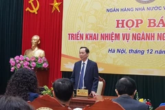 Phó Thống đốc Đào Minh Tú phát biểu tại họp báo. (Ảnh: PV/Vietnam+)