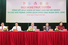 Các đại biểu chủ trì tại hội nghị. (Ảnh: CTV/Vietnam+)