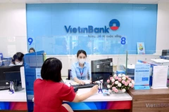 Giao dịch tại VietinBank. (Ảnh: Vietnam+)