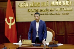 Thống đốc Ngân hàng Nhà nước Lê Minh Hưng phát biểu tại Hội nghị trực tuyến. (Ảnh: CTV)