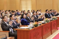 Thống đốc Ngân hàng Nhà nước Lê Minh Hưng cùng các đại biểu tam dự hội nghị. (Ảnh: CTV/Vietnam+)