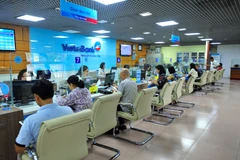 Giao dịch tại VietinBank. (Ảnh: Vietnam+)