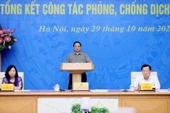 Hội nghị diễn ra dưới sự chủ trì của Thủ tướng Phạm Minh Chính, Trưởng Ban Chỉ đạo quốc gia phòng, chống dịch COVID-19, Phó Thủ tướng Chính phủ Lê Minh Khái và Trưởng Ban Dân vận Trung ương Bùi Thị Minh Hoài. (Ảnh: Dương Giang/TTXVN)