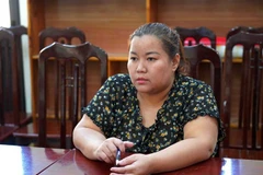 Đối tượng Nguyễn Thị Huyền tại cơ quan Công an. (Ảnh: Nguyễn Lân/TTXVN phát)