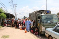 Từ ngày 7/7/2015, Công an tỉnh Bình Phước đã tiến hành phong tỏa, khám nghiệm hiện trường vụ trọng án đặc biệt nghiêm trọng tại xã Minh Hưng, huyện Chơn Thành. (Ảnh: TTXVN)