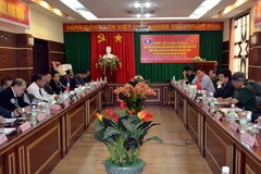 Quang cảnh buổi làm việc giữa Ban Chỉ đạo Tây Nguyên và Ban Chỉ đạo Xóa đói giảm nghèo và Phát triển Nông thôn Lào. (Ảnh: Việt Dũng/Vietnam+)