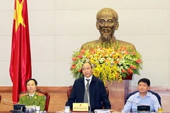 Phó Thủ tướng Nguyễn Xuân Phúc, Chủ tịch Ủy ban An toàn giao thông Quốc gia, chủ trì Hội nghị. (Ảnh: Doãn Tấn/TTXVN)