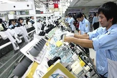 Hoạt động sản xuất ở khu công nghiệp Sài Đồng B, Hà Nội. (Nguồn: TTXVN)