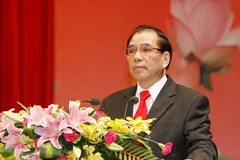 Tổng Bí thư Nông Đức Mạnh đọc diễn văn tại lễ kỷ niệm. (Ảnh: Thống Nhất/TTXVN) 