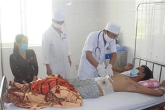Bệnh nhân Nguyễn Văn Sớm được điều trị tại bệnh viện Đa khoa tỉnh Bạc Liêu. (Ảnh: Huỳnh Sử/TTXVN)