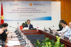 Bộ trưởng Bộ Công Thương Trần Tuấn Anh chủ trì cuộc họp tại đầu cầu Hà Nội. (Ảnh: Trần Việt/TTXVN)