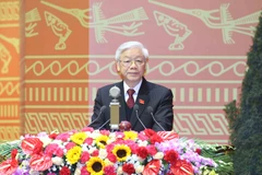 Tổng Bí thư Nguyễn Phú Trọng đọc Báo cáo của Ban Chấp hành Trung ương Đảng khóa XI về các văn kiện trình Đại hội XII của Đảng. (Ảnh: TTXVN)
