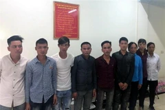 Các đối tượng tại cơ quan điều tra. (Ảnh: Xuân Hoàng/TTXVN)