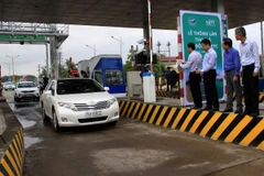Việc thỏa thuận giữa nhà đầu tư BOT và đơn vị thu phí tự động vẫn đang còn vướng mắc. (Ảnh: TTXVN)
