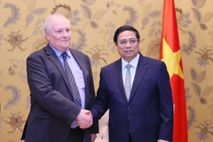 Thủ tướng Phạm Minh Chính tiếp Chủ tịch Tập đoàn Enterprize Energy Ian Hatton. (Ảnh: Dương Giang/TTXVN)