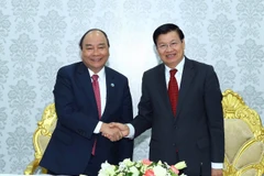 Thủ tướng Nguyễn Xuân Phúc và Thủ tướng nước CHDCND Lào Thongloun Sisoulith. (Ảnh: Thống Nhất/TTXVN .)
