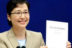 Phát ngôn viên Phòng thông tin Hội đồng Nhà nước Trung Quốc Xi Yanchun công bố Sách trắng đề cập quan hệ thương mại Trung Quốc- Mỹ tại Bắc Kinh ngày 24/9/2018. (Ảnh: Reuters/TTXVN)