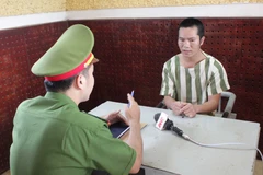 Đối tượng Phạm Văn Diễn tại cơ quan điều tra. (Nguồn: TTXVN)