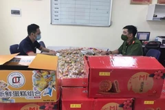 Đối tượng Nguyễn Văn Nam và số hàng nhập lậu.