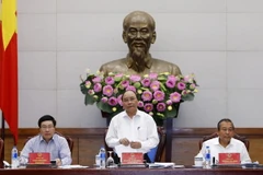 Thủ tướng Nguyễn Xuân Phúc và các Phó Thủ tướng họp Thường trực Chính phủ về tình hình thực hiện Luật Doanh nghiệp và Luật Đầu tư năm 2014. (Ảnh: Thống Nhất/TTXVN)