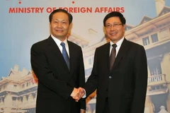 Phó Thủ tướng, Bộ trưởng Ngoại giao Phạm Bình Minh tiếp Bí thư Khu ủy Quảng Tây Bành Thanh Hoa. (Ảnh: Nguyễn Khang/TTXVN)