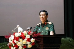 Đại tướng Phan Văn Giang, Bộ trưởng Quốc phòng phát biểu tại hội nghị tiếp xúc cử tri. (Ảnh: Thu Hằng/TTXVN)