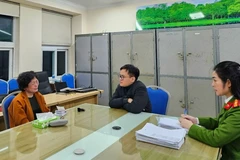 Đối tượng Phạm Thị Hòa, cựu Chủ tịch Hội đồng quản trị Công ty Cổ phần Tập đoàn Sen Tài Thu, tại cơ quan Công an. (Ảnh: TTXVN phát)