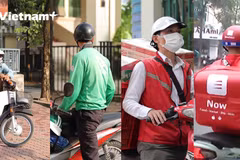 Shipper trở thành một ngành nghề quan trọng trong xã hội, nhất là vào mùa dịch. (Ảnh: Hoàng Đạt/Vietnam+) 