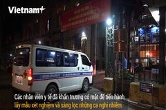 Lực lượng y tế tới làm việc tại Bộ giao thông vận tải (Ảnh: Hoàng Đạt/Vietnam+)