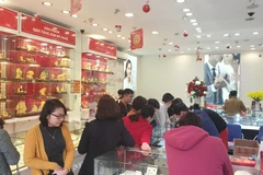 Giao dịch vàng tại doanh nghiệp. (Ảnh: PV/Vietnam+)