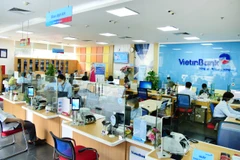 Giao dịch tại VietinBank. (Ảnh: Vietnam+)
