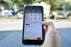 Cake là ngân hàng số đầu tiên được kết nối để hiển thị trên nền tảng ứng dụng gọi xe. (Ảnh: Vietnam+)