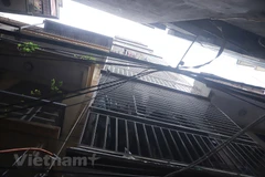 Hiểm họa cháy nổ từ các công trình nhà ở riêng lẻ "hóa" chung cư mini. (Ảnh: Hoài Nam/Vietnam+)