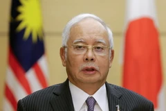 Thủ tướng Malaysia Najib Razak trong cuộc họp báo ở Tokyo ngày 16/11 vừa qua. (Ảnh: AFP/TTXVN)