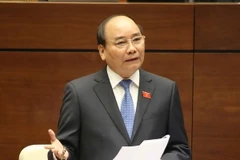 Thủ tướng Chính phủ Nguyễn Xuân Phúc trả lời chất vấn các đại biểu quốc hội. (Ảnh: Phương Hoa/TTXVN)