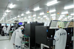Sản xuất, lắp ráp linh kiện điện tử tại Công ty Power Logics Vina (100% vốn đầu tư Hàn Quốc) tại Khu công nghiệp Khai Quang (Vĩnh Phúc). (Ảnh: Danh Lam/TTXVN)