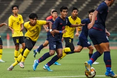 U19 Malaysia (áo vàng) đánh bại Thái Lan để giành vé dự vòng chung kết. (Nguồn: AFC)