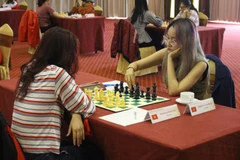 Các vận động viên thi đấu nội dung cờ tiêu chuẩn vòng thứ 5. (Ảnh: Tùng Lâm/TTXVN)