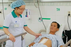 Sức khỏe của bệnh nhân Đặng Vĩ H. đã phục tốt sau ca phẫu thuật. (Ảnh: Trần Lê/Vietnam+)